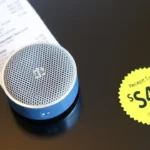 Round speaker with receipt and $49 price tag.
